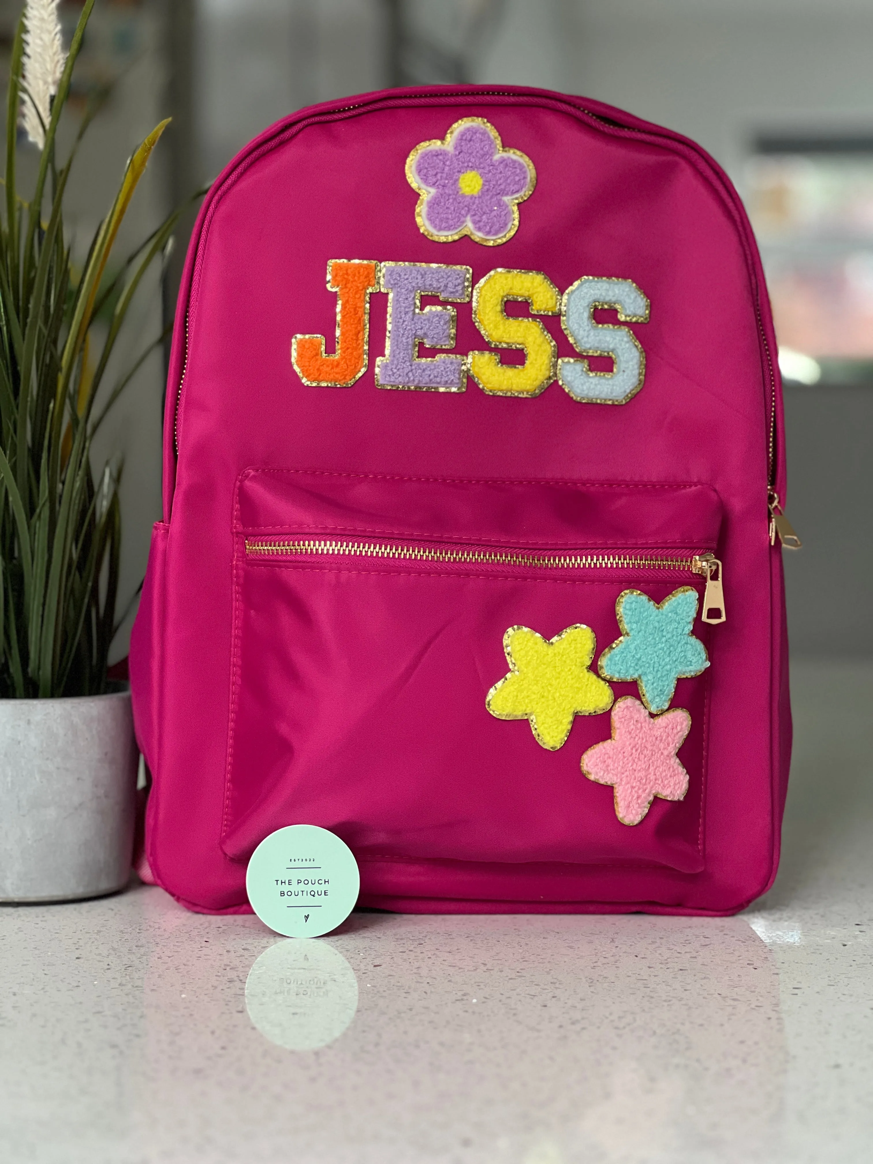 Best selling backpack with patch letter & motifs